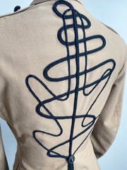 Back detail of vintage USMC American khaki jacket featuring the hand-embroidered line art on the back done with a black Japanese cording.