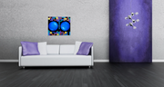 Oil on canvas original painting inspired by vintage game, Tetris, featuring two large blue orbs surrounded by colorful Tetris blocks on a black background. The image shows the painting in a modern room hanging on a gray wall above a white couch.