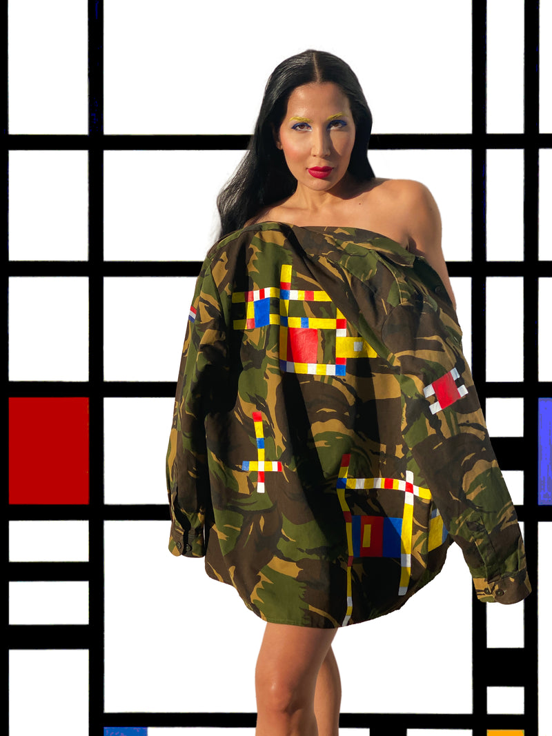 Model wearing a vintage Dutch camo jacket hand-painted with Piet Mondrian's "Broadway Boogie Woogie."