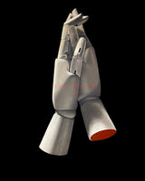 Oil painting by Shireen Renee: Two articulated wooden mannequin hands hold each other against a black background. One hand cradles the other, their fingers intertwined. The hands are grayscale, with a vibrant red stump visible on the right. The focus is on connection and the contrast between realistic wood and the void.