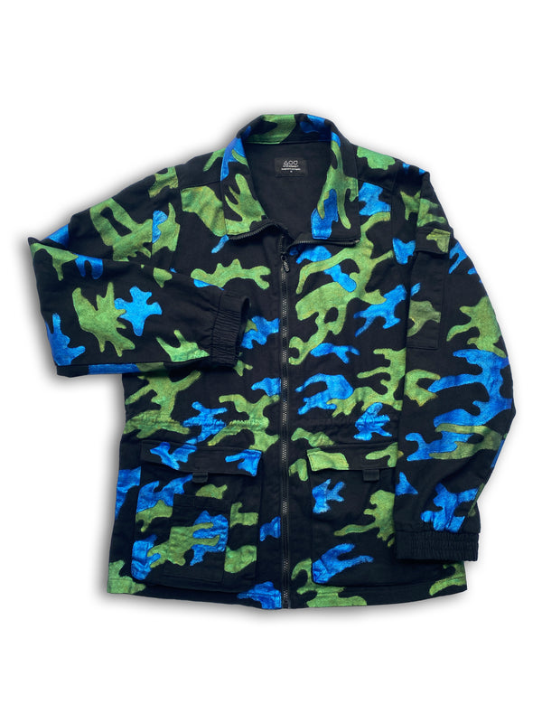 Front view of the Art Of Uniformity "Camo Planet" organic black brushed cotton unisex jacket with blue and green hand-painted camo print.