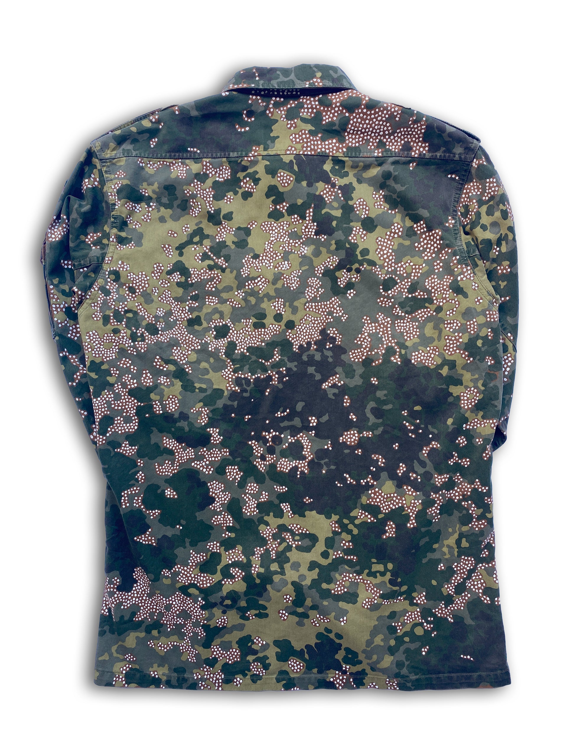 The "Frost" jacket is a vintage 80s German camo jacket with tiny, hand-painted white dots inside the brown parts of the flecktarn pattern.