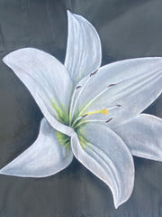 Detail image of the white hand-painted lily on the side of a French vintage army shirt.