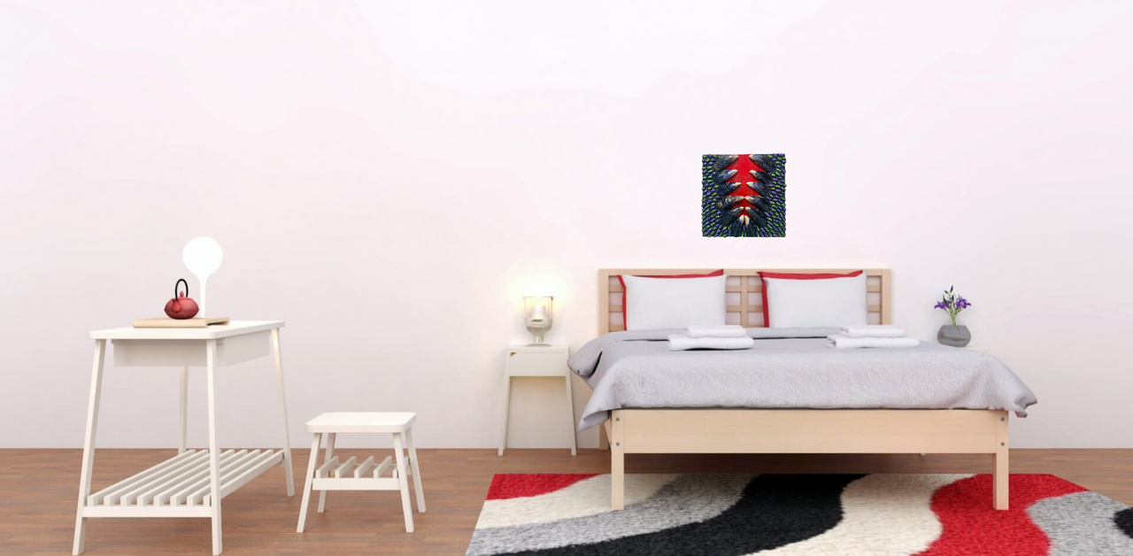 Close-up of a mixed media artwork by Shireen Renee, showing mussel shells, painted pistachio shells in purple and green, and rhinestones arranged on a wood panel with a red stripe down the center. The image shows the art hanging in a bedroom on a plain white wall above a bed.